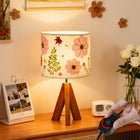 LinkMejor Dried Flowers Tripod Table Lamp 14.96in, 9W LED Dimmable Cute Bedside Lamp with Flowers Linen Lampshade for Nursery, Bedroom, Kid Room, Living Room, Light Brown Wooden Base